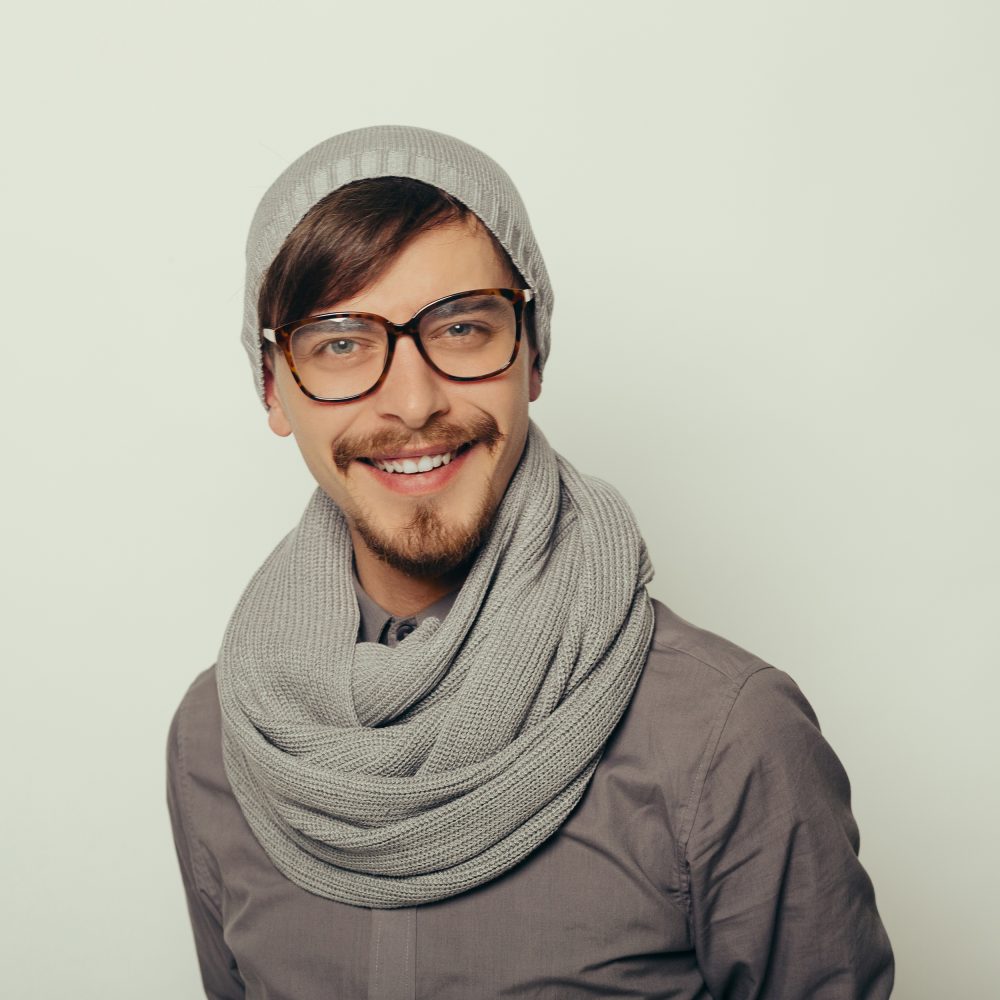 Portrait of an interesting young man in winter clothes